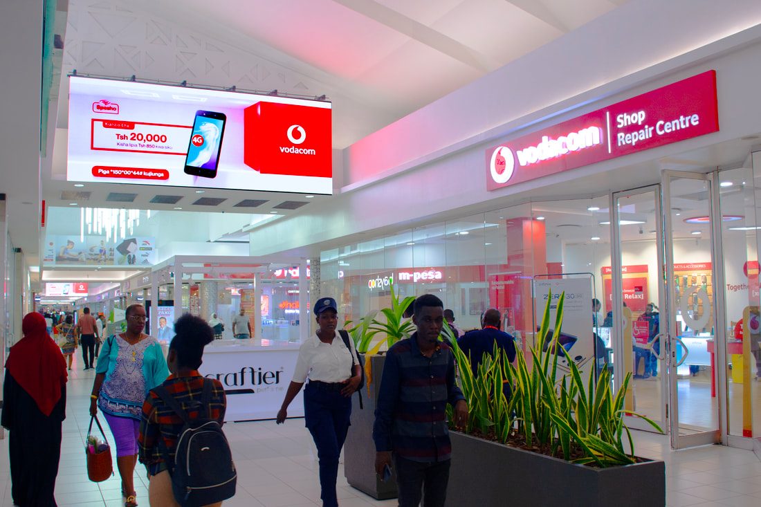 A Vodacom screen above the Vodacom shop inside Mlimani City Mall